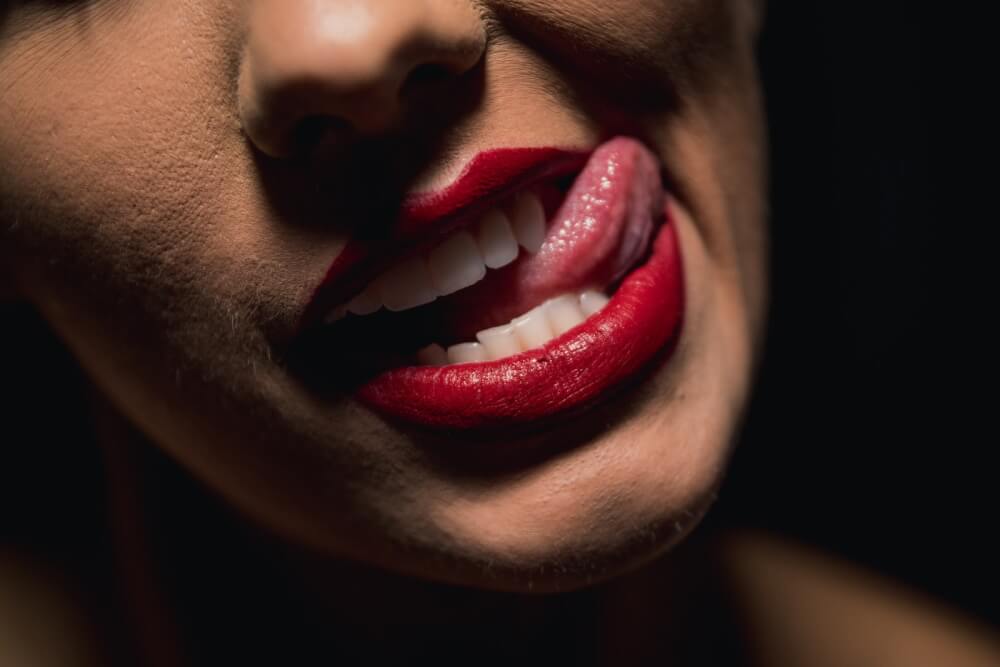 best tongue scraper woman with red lipstick