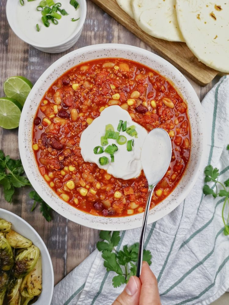 high protein vegetarian meals a bowl of chili with sour cream on top