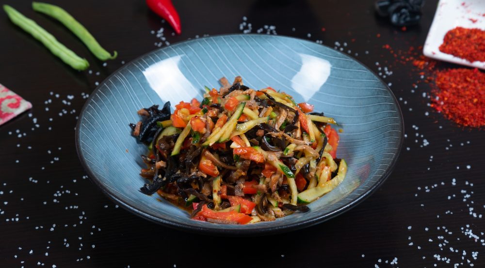 high protein vegetarian meals a plate of stir fried vegetables on a table